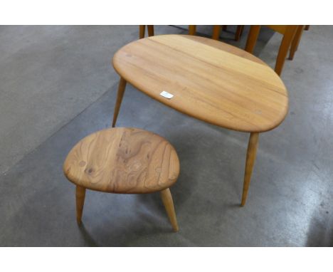 An Ercol elm and beech pebble shaped nest of two tables 