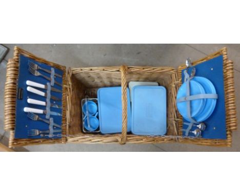 A wicker picnic hamper, containing Brexton picnicware 