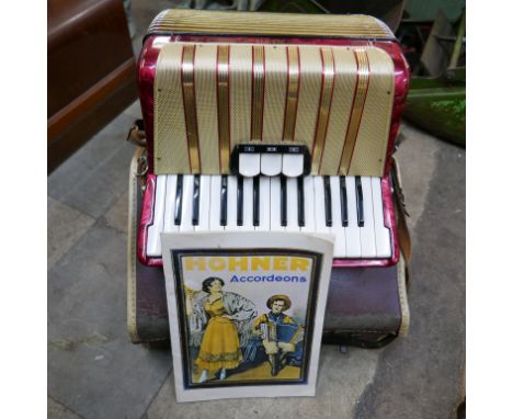 A cased Hohner accordion 