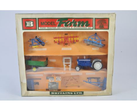 Britains Set No. 9596 Farm Tractor and Implements Set. Includes 3 Furrow Plough, Cultivator, Roller, Trailer, Tractor Cab, Fo