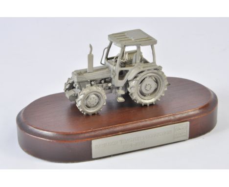 Scarce Pewter Ford 7810 Tractor mounted on a plinth. Marked Basildon Tractor Production. These were given to new owners of th