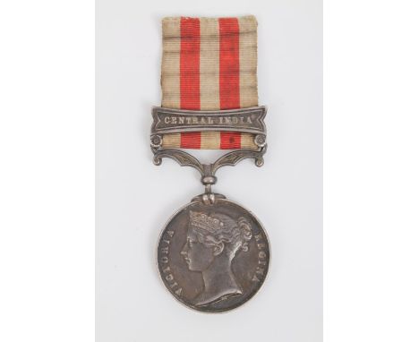 Victorian Indian Mutiny medal with central India clasp with engraved name GUN. R. E. HARRISON. 4TH. CO. 14TH BATTN. R.A. (swi