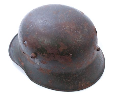 First World War Imperial German steel helmet, with traces of original dark green / brown painted finish, two holes to helmet 