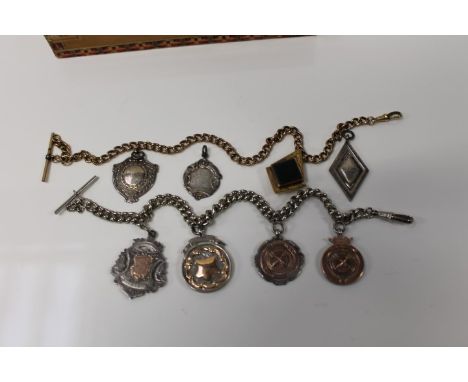 Yellow metal Masonic hardstone and compass fob, together with a silver Albert chain and various sporting fobs