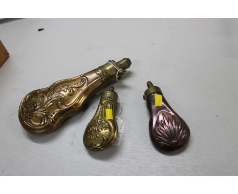 Two Victorian copper and brass pistol powder flasks and Victorian Hawksley powder flask with scrollwork decoration (3)