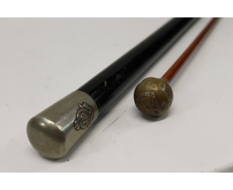 Royal Fusiliers swagger stick with ebonised wood shaft and plated top with Regimental badge, together with an Essex Regiment 