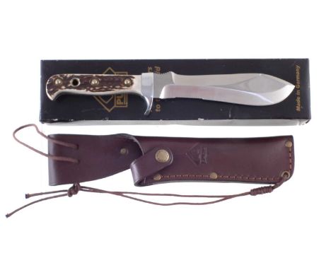 Puma White Hunter knife, with leather scabbard, the double edge blade with saw sections fitted with horn grips, together with