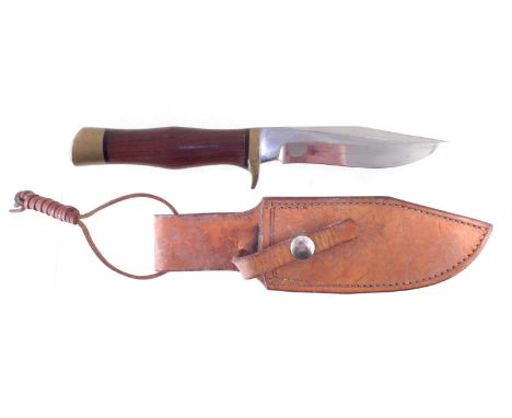 Hibben Elma Keith design knife and in leather scabbard, faint legend to reverse of scabbard, rosewood grip with brass mounts,