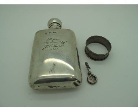 A Hallmarked Silver Hip Flask, engraved with "Piper Walker By" G.H.Hirst 1921"; together with a hallmarked silver napkin ring