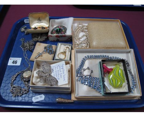 Three Openwork Filigree Butterfly Brooches, a marcasite set fancy necklace, similar brooch and clip earrings, a claw set flor