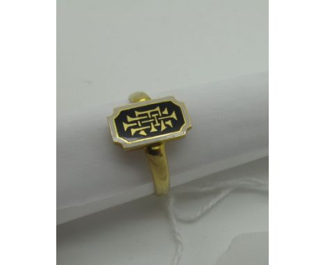 An Ornate Enamel Signet Ring, with rectangular panel, initialled, stamped "18ct", (ring size R½), (4 grams).