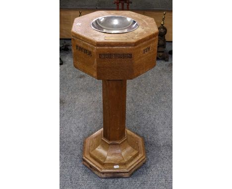A 20th century light oak octagonal church font with carved inscription, suffer the little children come unto me, with brass p