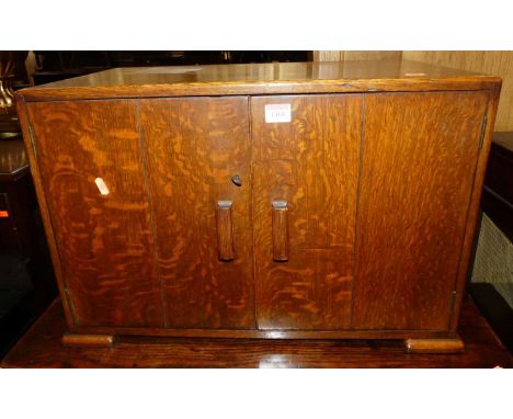 An Art Deco oak double door table top record cabinet, width 62.5cm