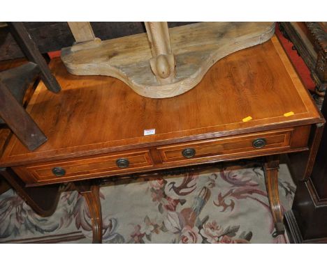 A contemporary yew wood two drawer dropflap sofa table, w.94cm (leaves down) 