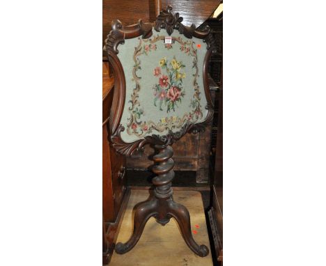 A mid-Victorian mahogany floral carved and tapestry inset pole screen