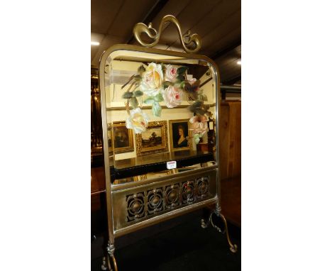 A late Victorian brass, mirrored glass and floral painted firescreen, width 47cm