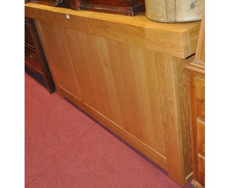 A contemporary light oak three door sideboard, having three frieze upper drawers, w.156cm 