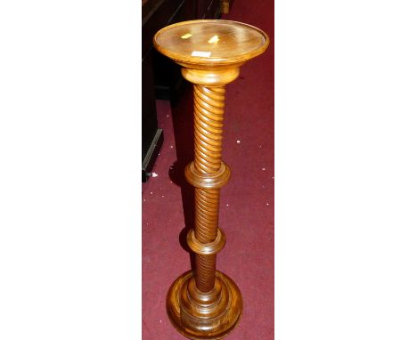 A contemporary beech spiral turned plant stand, height 99cm