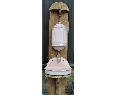 An enamelled metal and pine backed French wall mounted basin, height 190cm