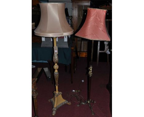 A cream and silver painted floral decorated standard lamp, raised on triform outswept base; together with a cast brass standa