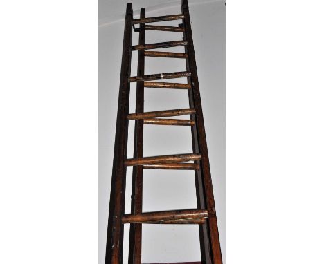 A stained pine and metal bound 14 tread decorator's ladder, together with one other similar slightly narrower example, length