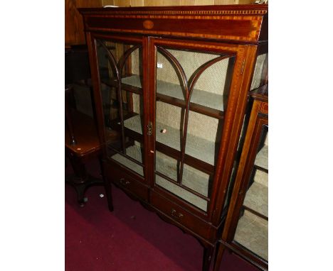 An Edwardian mahogany and satinwood inlaid double door china display cabinet, having twin short lower drawers, width 107.5cm,