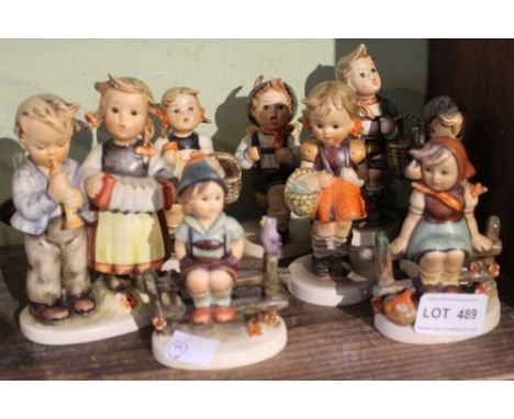 A pair of Goebel Hummel ceramic figures, includes a pair of children sat on fences, (individual pieces 8)&nbsp;&nbsp;