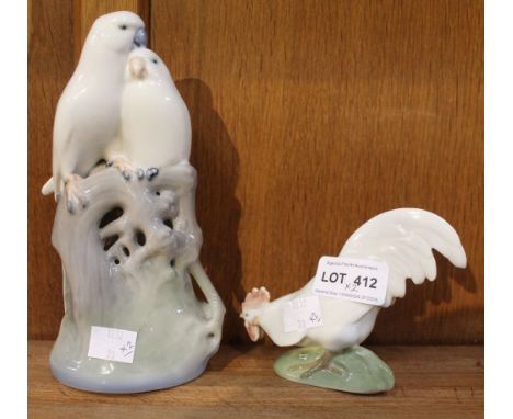 Two Royal Copenhagen ceramic figures, being one of two Budgerigars 649, and a cockerel 1127 (2)
