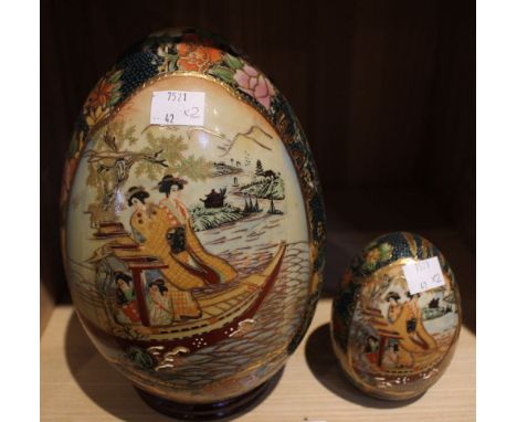 Two painted Oriental style ceramic eggs