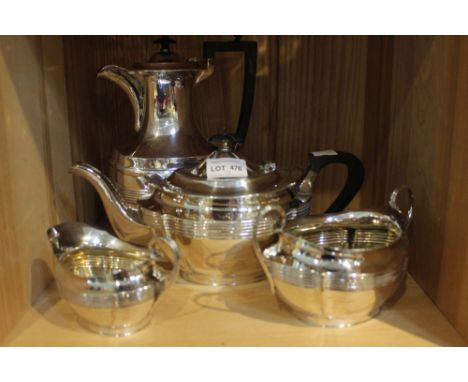 A silver plated tea set, comprising teapot, sugar bowl and milk jug, together with a matching hot water pot, Georgian design 
