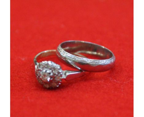 An 18ct gold diamond cluster ring, together with a platinum wedding band, weight: 3.8g