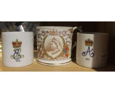 A pair of Edward Vll 1902 mugs, each with a light portrait in the base, together with an 1897 Queen Victoria tankard (3)&nbsp