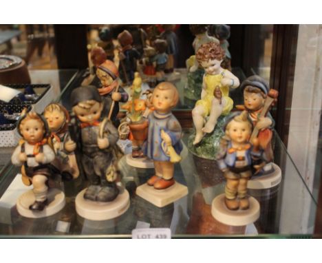 A Royal Worcester ceramic figurine "Friday's Child is Loving and Giving", together with a collection of eight Hummel figures&