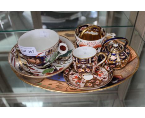 A Royal Crown Derby miniature kettle, decorated in the Imari taste, together with a Royal Crown Derby miniature cup &amp; sau