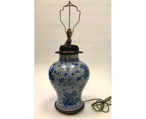 EARLY 20TH CENTURY CHINESE BLUE AND WHITE VASE converted to a lamp with carved wood stand as base and matched lid, the vase d