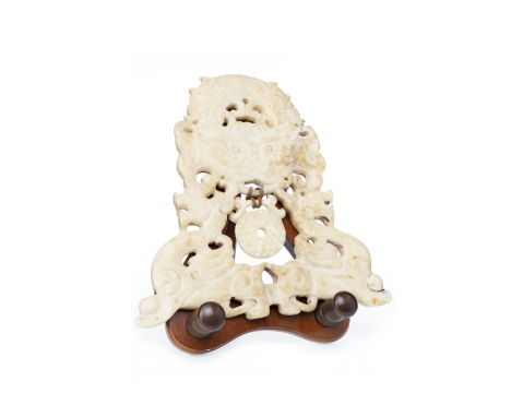 20TH CENTURY CHINESE MUTTON FAT JADE PLAQUE feng shui, carved and pierced with mythical creature and a central medallion, 20c