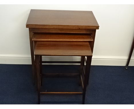 A 19th century Waring & Gillows mahogany card table with two graduated under tables