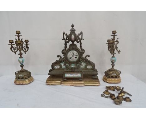A French 19th century clock garniture with four-sconce candelabra