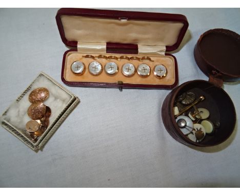 A quantity of gold cufflinks; together with a cased button set etc