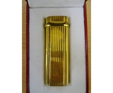 A cased Must de Cartier lighter