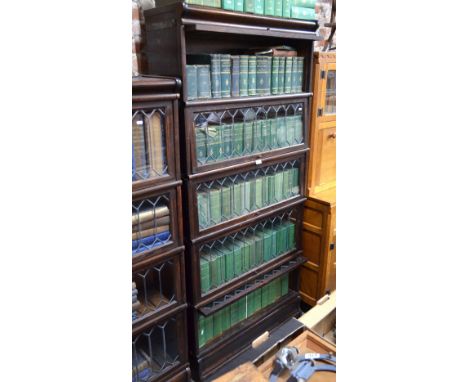 An oak Globe Wernicke style sectional oak bookcase in five parts, each having diamond lead glazed doors, on a plinth base 188