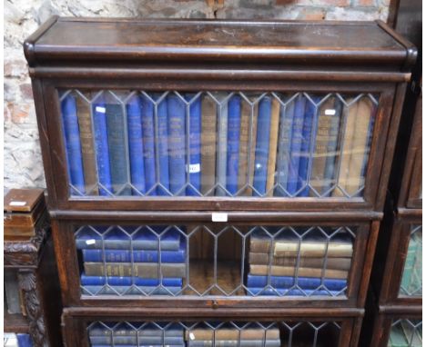 An oak Globe Wernicke style sectional oak bookcase in four parts, each having diamond lead glazed doors, on a plinth base 188