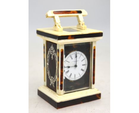 An early 20th century US tortoiseshell, ivory and bone carriage clock with enamel dial and French movement, 12 cm high (inclu