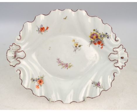 A Chelsea or Chelsea-style, leaf-shaped dish, sparsely decorated with a ladybird beside floral designs; 24.5 cm diameter; the