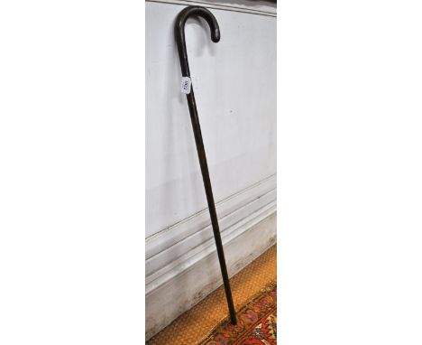 An unusual rattan-pole self-defence walking stick concealing a weighted cosh on spring, c.1900 Condition Report Stick is scuf