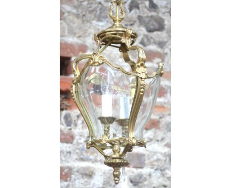 An Art Nouveau style brass hall lantern with curved glass panels 45 cm high approx
