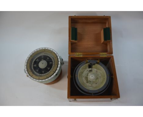 A CMB Compass no 124, painted in battleship grey, 18 cm mounted on gimbals in teak box, to/w a Royal Navy Compass Patt 8131 w