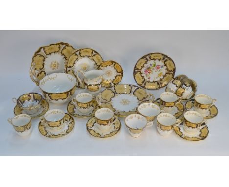 A Victorian Ridgway moulded and plain part tea/coffee service, fawn panel edged in blue with gilded decoration, mixed pattern