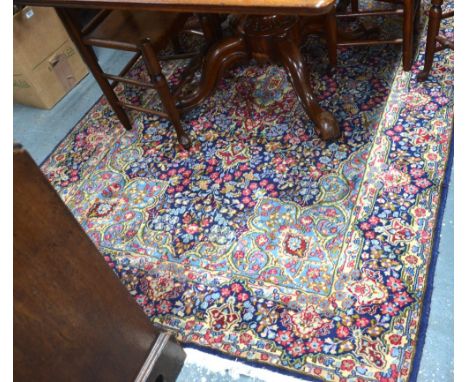 A Persian Kirman rug, floral centre medallion on pale blue ground, 2.40 x 1.57 m
