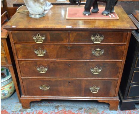 An 18th featherbanded mahogany chest of two short over three long graduated drawers, raised on shaped bracket feet, 93 cm hig